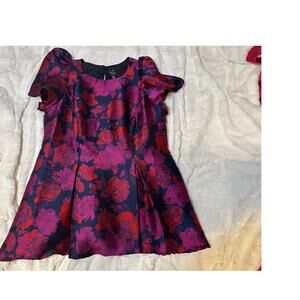 Adrianna Papell dress with a magenta and navy blue floral jacquard pattern.